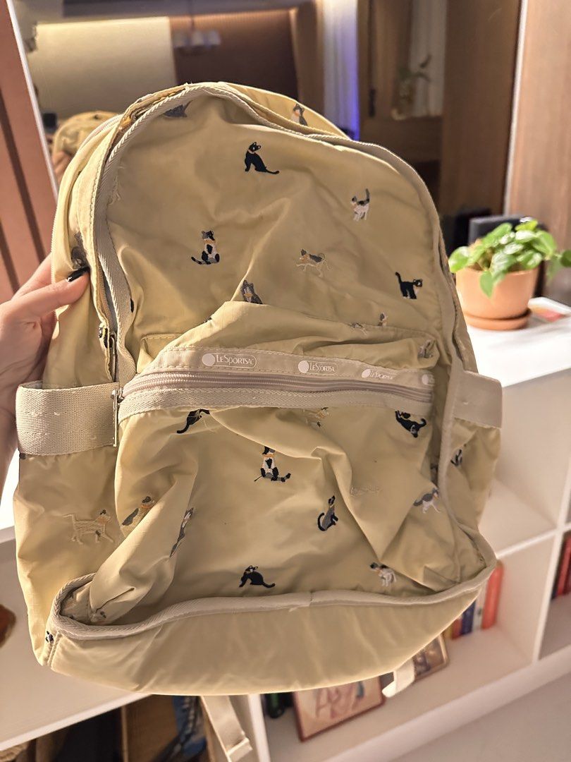 Must go! Cat backpack (Category: Backpacks) located in Manila. Submitted by vccustods339 (Listing ID 1460157683, Image 2). Description: Rfs: decluttering! Negotiable! Has embroidered cats kn it, honest issue: has marker stain sa likod Message me for more details!.