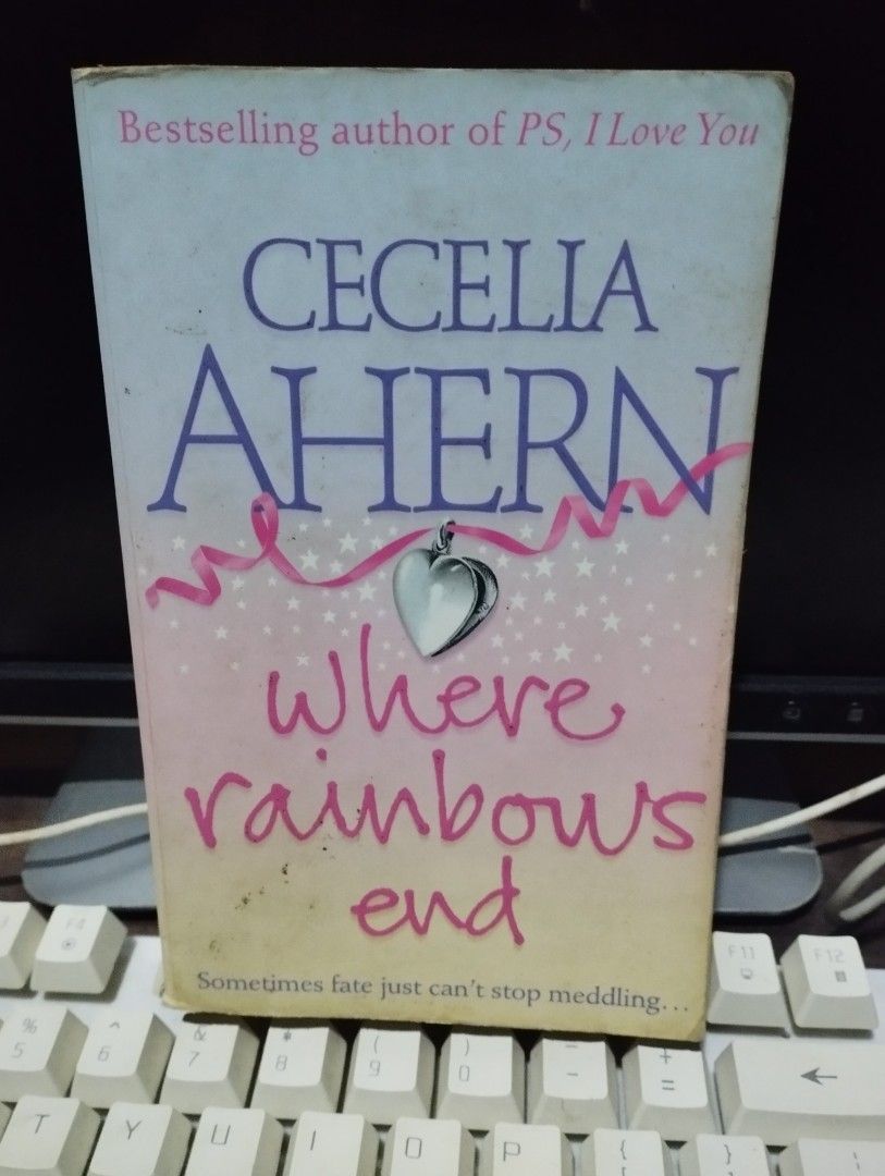 CECELIA AHERN (Category: Storybooks) located in Bulacan. Submitted by page5877bookshoppe (Listing ID 1460259889, Image 1). Description: - Book Title: Where Rainbows End - Author: Cecelia Ahern (Bestselling author of PS, I Love You) - Design: Features a pink ribbon and heart charm on the cover. - Tagline: 'Sometimes fate just can't stop meddling...' - Condition: Good, with minor signs of wear..