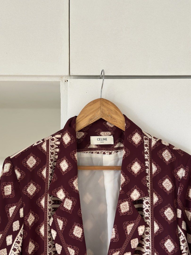 Celine Burgundy Geometric Print Blazer (Category: Coats, Jackets and Outerwear) located in Marikina City. Submitted by usage.ph (Listing ID 1460135120, Image 2). Description: - Burgundy blazer with a stylish cream geometric print. - Features a classic lapel and secure button closure. - Includes two functional front pockets. - Effortlessly transitions from casual to formal wear. - A perfect statement piece to elevate any outfit..