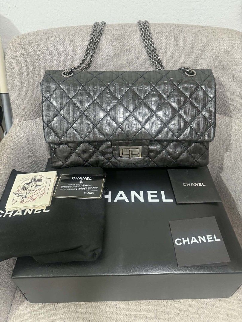 Chanel 22.5 Re-Issue Double Flap (Category: Luxury Bags & Wallets) located in Las Pinas. Submitted by whimsyandwonder (Listing ID 1460121539, Image 1). Description: - Authentic Chanel Bag - Color: Black - Material: Quilted Leather with unique striped pattern - Hardware: Silver-tone - Strap: Chain strap - Interior: Clean - Authenticity: Comes with authenticity card and serial number sticker - Included Accessories: Dust bag and box.