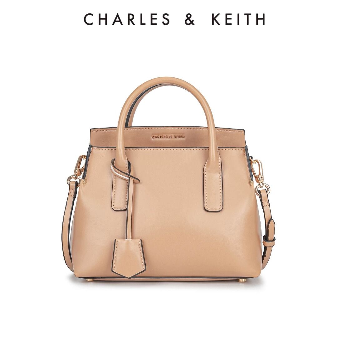Charles & Keith Rene Structured Top Handle Bag (Category: Wallets & Card holders) located in Quezon City. Submitted by makescentsmnl (Listing ID 1460253296, Image 2). Description: Charles & Keith Rene Structured Top Handle Bag ORIG MALL PULLOUT Size:26x22x8 cm With dust bag&serial number MOP ✅GCASH ✅BANK TRANSFER ✅CREDIT CARD ✅QRPH.