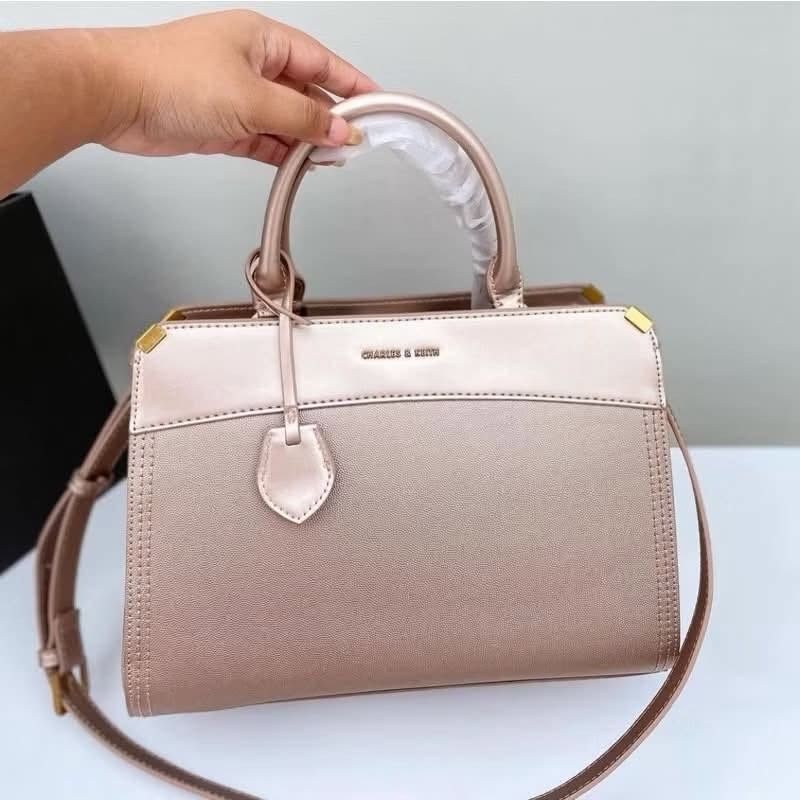 Charles & Keith top-handle bag (Category: Shoulder Bags) located in Quezon City. Submitted by makescentsmnl (Listing ID 1460262429, Image 2). Description: Charles & Keith top-handle bag ORIG MALL PULLOUT Size:14 inches With dust bag&serial number MOP ✅ GCASH ✅ BANK TRANSFER ✅ CREDIT CARD ✅ QRPH.