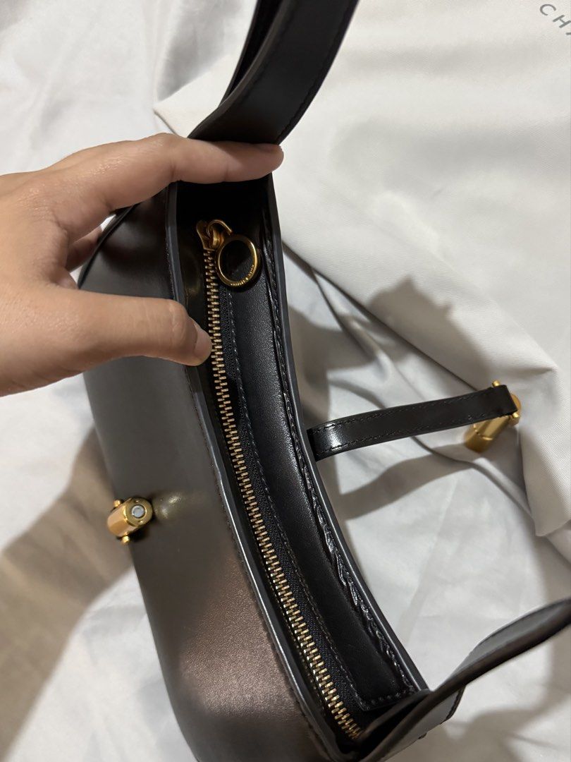 Charles and Keith Cesia Black Shoulder Bag (Category: Shoulder Bags) located in Quezon City. Submitted by a_closet04 (Listing ID 1460143982, Image 2). Description: - Brand: Charles & Keith - Color: Black - Feature: Gold buckle detail on the front - Closure: Zipper - Includes: Dust bag - Ideal for: Everyday use - my most favorite bag ever!!! RFS: investing in real leather bags 🤍.
