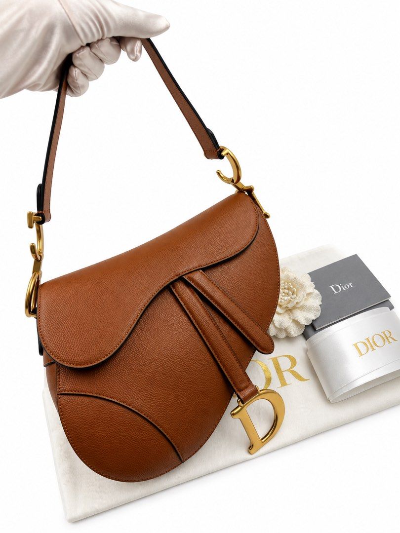 ⚜️Christian Dior - Saddle Medium bag🤎 (Category: Luxury Bags & Wallets) located in Makati City. Submitted by 90sangel (Listing ID 1460196680, Image 1). Description: That iconic saddle shape just hits different 🤎🐴 Timeless, effortlessly chic, and the kind of bag that makes every outfit feel expensive without even trying. •Size: Medium •Condition: As New! *Includes store dustbag, carecard and big paperbag. Box is optional not included from the S