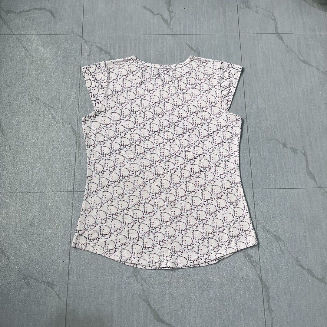 Christian Dior All-Over Monogram Womens Tops (Category: Shirts) located in Cavite. Submitted by newclassicwear (Listing ID 1460175894, Image 2). Description: Size 18width 23length Missing Washtag Excellent Condition 9.8 Honest Color Rate None Any Issue White Christian Dior t-shirt with the iconic Dior monogram pattern all over. Short sleeves. The fabric feels soft and comfortable. Great piece for any fashion lover. Perfect for casual wear or dres