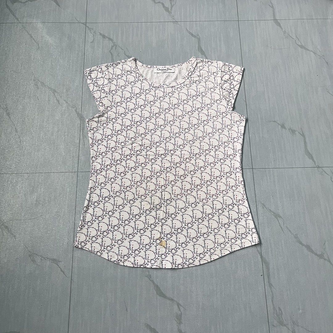 Christian Dior All-Over Monogram Womens Tops (Category: Shirts) located in Cavite. Submitted by newclassicwear (Listing ID 1460175894, Image 1). Description: Size 18width 23length Missing Washtag Excellent Condition 9.8 Honest Color Rate None Any Issue White Christian Dior t-shirt with the iconic Dior monogram pattern all over. Short sleeves. The fabric feels soft and comfortable. Great piece for any fashion lover. Perfect for casual wear or dres