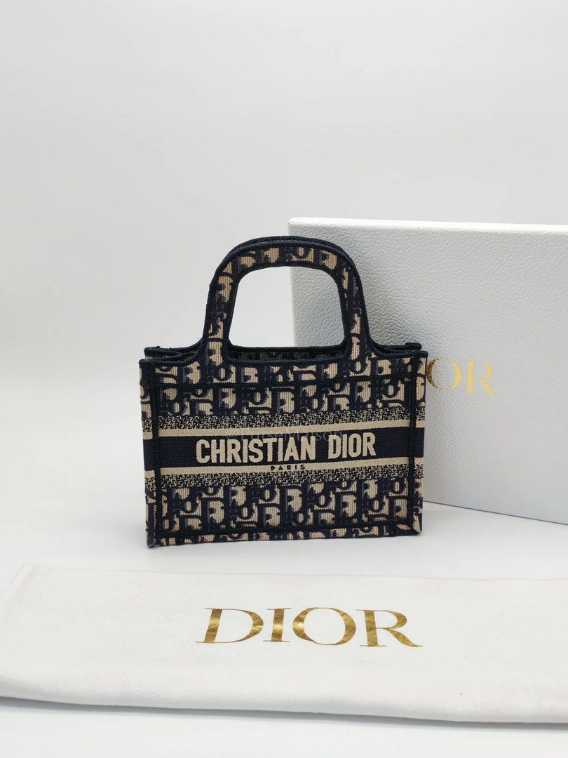 Authentic Christian Dior Book Tote Mini (Category: Luxury Bags & Wallets) located in Makati City. Submitted by sparks.joy (Listing ID 1460296287, Image 1). Description: - Authentic Dior Book Tote Mini bag - Iconic Dior Oblique canvas - Classic design with top handles - Ideal for carrying everyday essentials - Comes with original dust bag and box, and Entrupy Certificate.