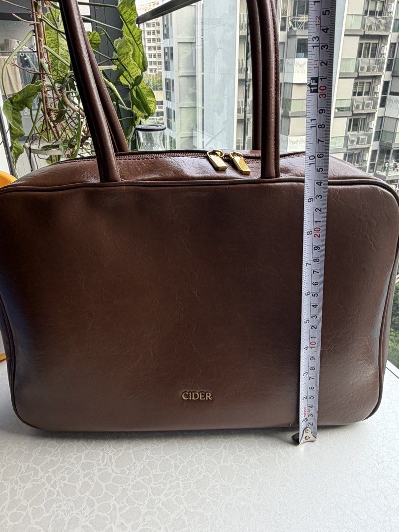 cider rectangular work bag (Category: Tote Bags) located in Singapore. Submitted by cocolouette (Listing ID 1460206691, Image 3). Description: cider work bag! chocolate brown color, closest to first pic miu miu beau bag doooooop 🤭 spacious interior with pockets. fits 13in macbook meetups at tamp only.