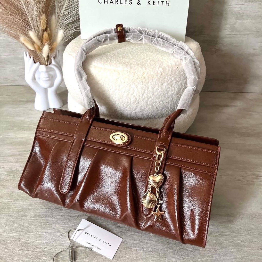 C&K Isolde Belted Ruched Shoulder Bag (Category: Shoulder Bags) located in Bulacan. Submitted by mykakarizza (Listing ID 1460302354, Image 3). Description: NEW NEW💖💖 ₱900 onlyyy C&K Isolde Belted Ruched Shoulder Bag Width 31.5 cm Depth 12 cm Height 14 cm Add paperbag 100 📸 Actual pics! 🙋🏻‍♀️ ─── ✦ ─── ✦ ─── ✦ ─── ✦ ─── 🛍️ LOOKING FOR MORE RESELLERS 🛍️ ✨ Buy 3 pcs of ANY items — FREE SHIPPING NA!🚚 ✨ Buy 10 items → FREE SF + ₱50 OFF EACH! �