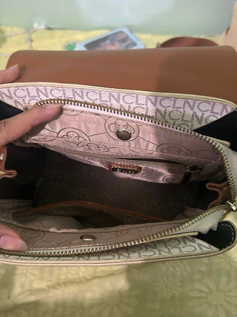 CLN Brown and White Monogram Backpack (Category: Backpacks) located in Marikina City. Submitted by kryznoring (Listing ID 1460172888, Image 2). Description: - Adorable brown and white monogram backpack - Stylish buckle details on the front - Multiple compartments inside for organization - Protective metal studs on the bottom - Adjustable straps for a comfortable fit.