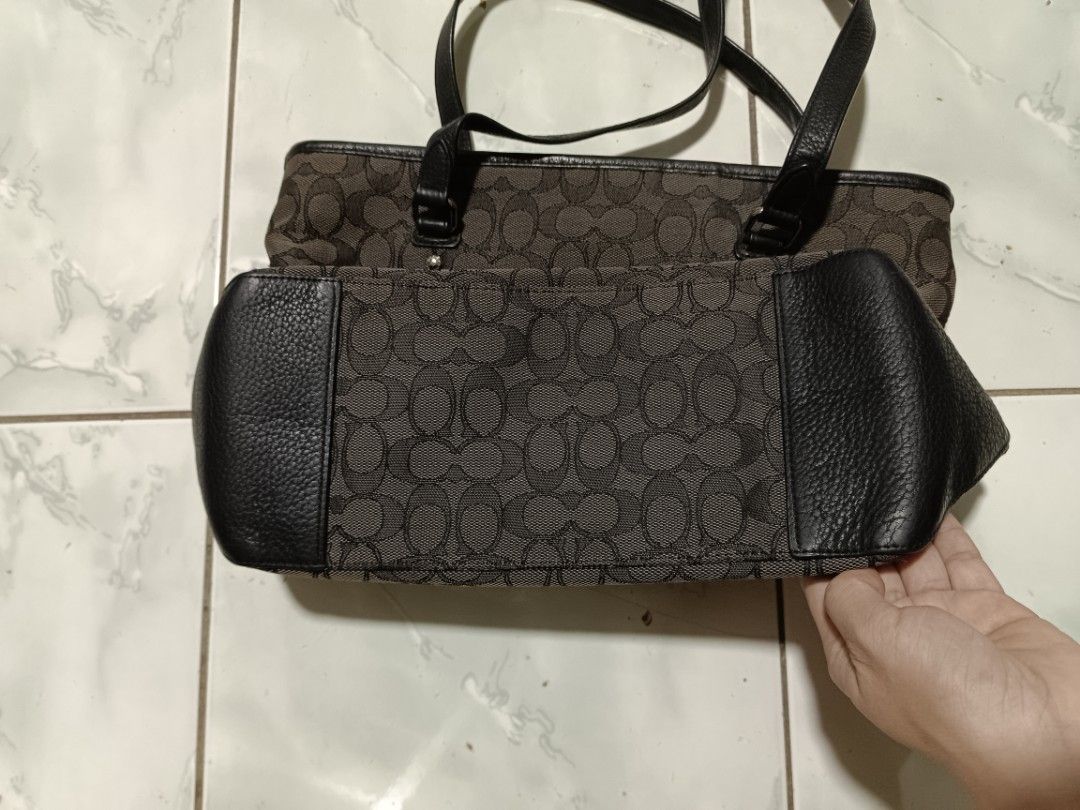 Coach Monogram Canvas Leather Trim Tote Bag (Category: Luxury Bags & Wallets) located in Manila. Submitted by caaths_collection (Listing ID 1460171919, Image 2). Description: - Classic Coach tote bag - Signature monogram canvas - Leather trim and handles - Zipper top closure - Spacious interior - Ideal for everyday use - Timeless design - made in vietnam.