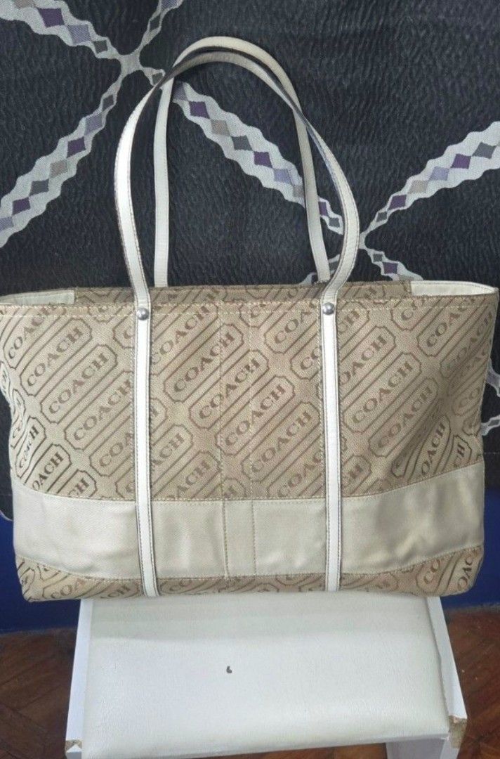OG Coach Monogram Canvas Tote (Category: Luxury Bags & Wallets) located in Manila. Submitted by affordabags_cd (Listing ID 1460225829, Image 2). Description: - Classic Coach tote bag - Beige canvas with all-over Coach logo pattern - White leather trim and handles - Secure zipper closure - Eye-catching red interior lining - Interior model number: H0849-F12253 - Ideal everyday bag.