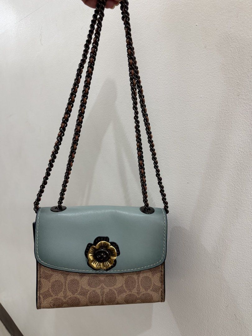 Coach Parker 18 Convertible chain bag (Category: Luxury Bags & Wallets) located in Makati City. Submitted by petite_preloved2 (Listing ID 1460131838, Image 1). Description: Authentic Minor fadings on the hardware Interior smells clean but the leather lining chipped off. Overall still a pretty and cute bag.