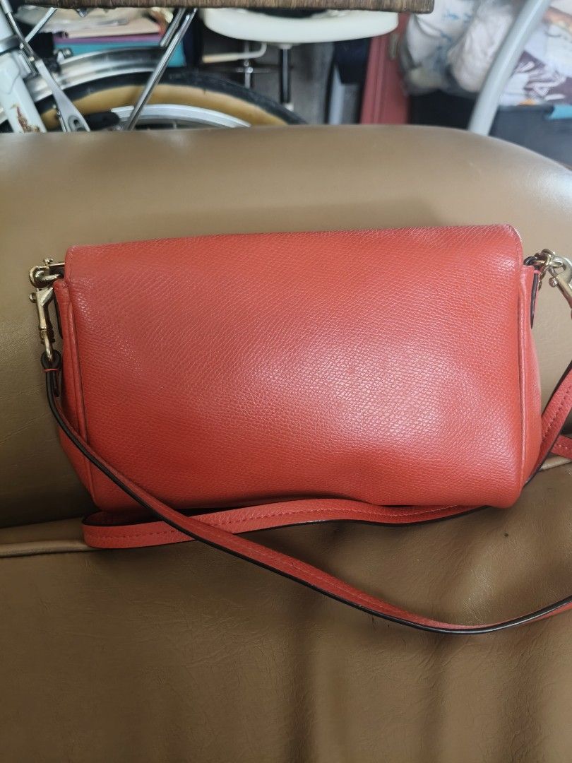 Coach Red Leather Chain Crossbody Bag (Category: Cross-body Bags) located in Bulacan. Submitted by aichang21 (Listing ID 1460118986, Image 2). Description: - Authentic Coach red leather crossbody bag - Elegant gold chain strap - Secure turnlock closure on the front - Convenient interior slip pocket - Made in Vietnam - Ideal for everyday casual outings.