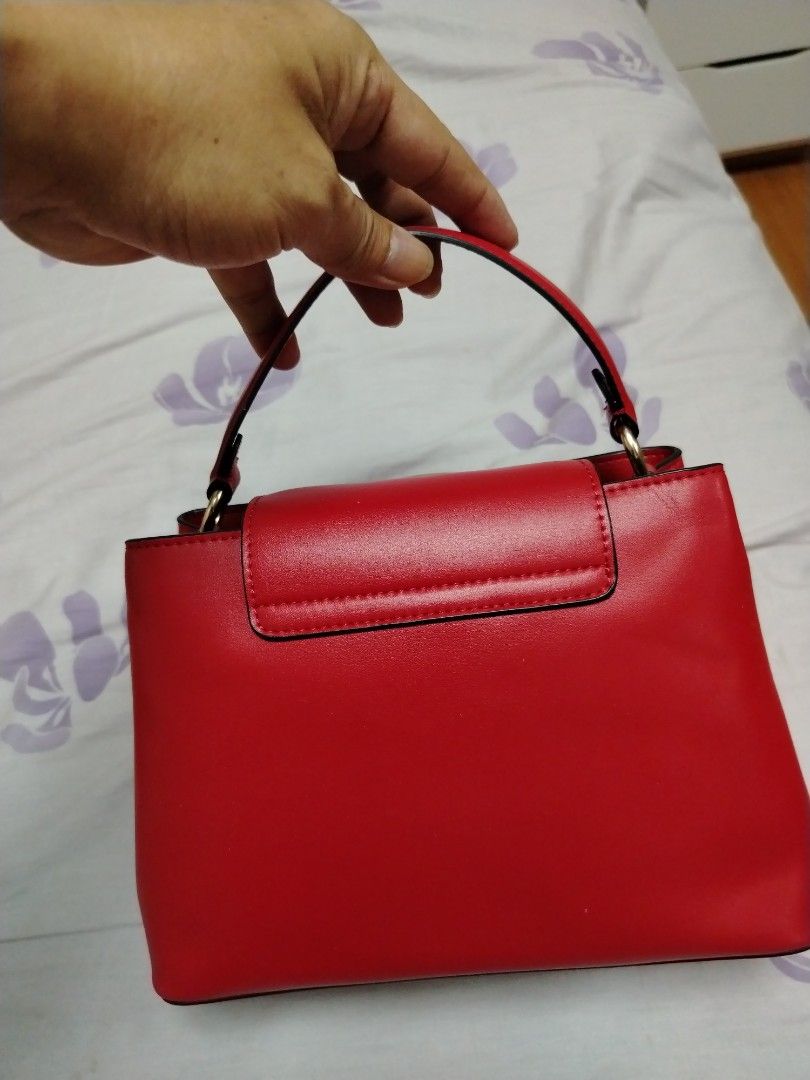 Coach Red Leather Top Handle Bag with Strap (Category: Luxury Bags & Wallets) located in Las Pinas. Submitted by PJ.R. (Listing ID 1460287704, Image 2). Description: - Genuine red leather Coach bag - Versatile top handle and detachable shoulder strap - Elegant gold hardware details - Interior zip pocket for essentials - Immaculate condition, clean inside and out - Perfect for everyday errands or a stylish night out.