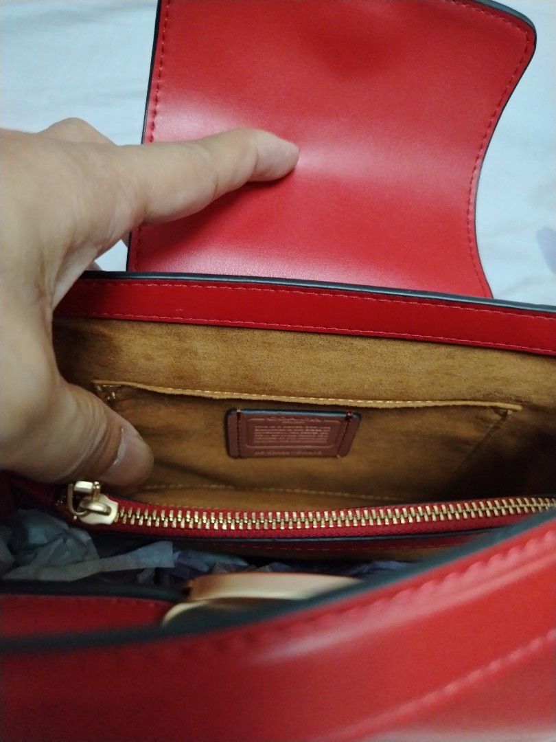 Coach Red Leather Top Handle Bag with Strap (Category: Luxury Bags & Wallets) located in Las Pinas. Submitted by PJ.R. (Listing ID 1460287704, Image 3). Description: - Genuine red leather Coach bag - Versatile top handle and detachable shoulder strap - Elegant gold hardware details - Interior zip pocket for essentials - Immaculate condition, clean inside and out - Perfect for everyday errands or a stylish night out.