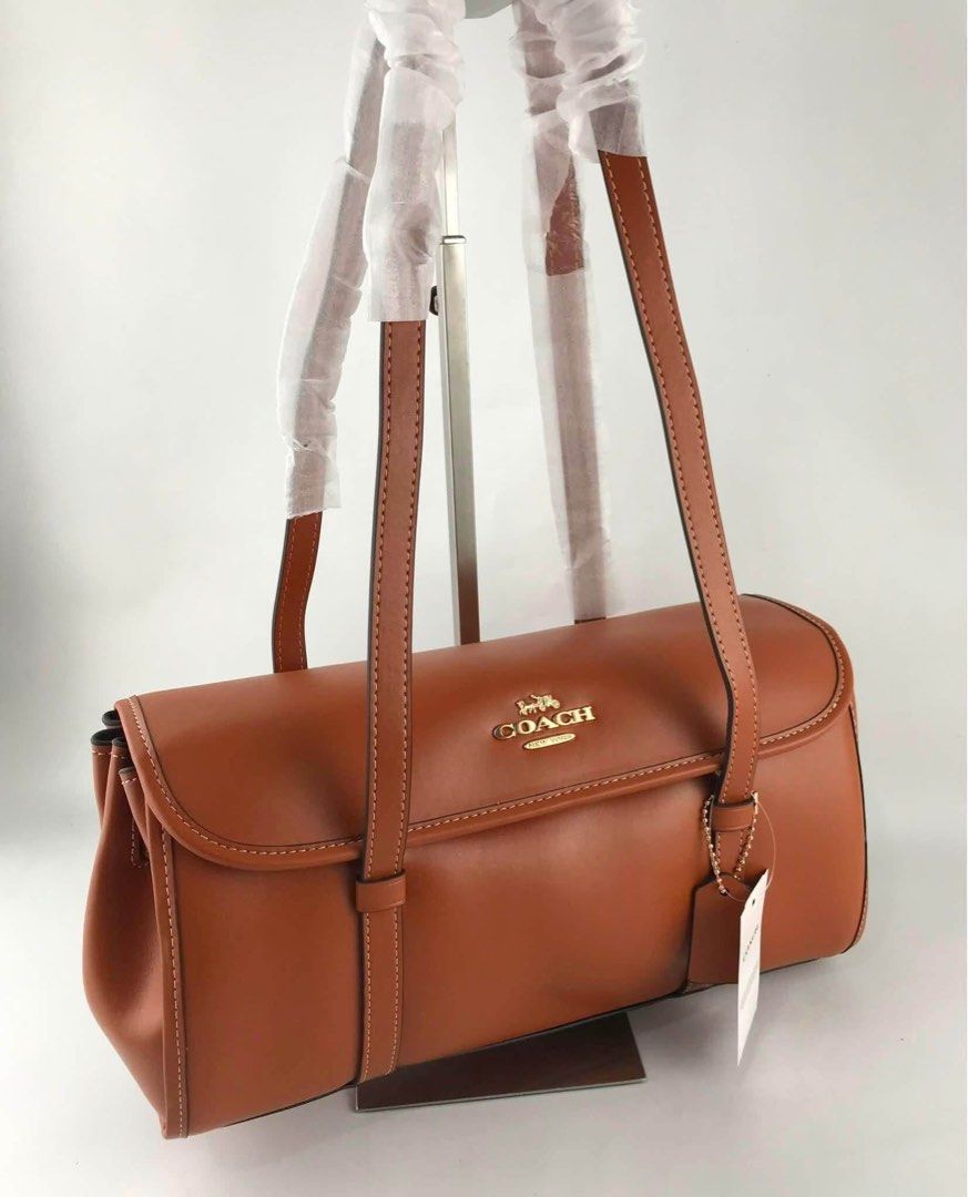 Coach shoulder bag (Category: Shoulder Bags) located in Manila. Submitted by gff.daily_flower (Listing ID 1460131390, Image 1). Description: With tag gift receipt dustbag and paperbag.