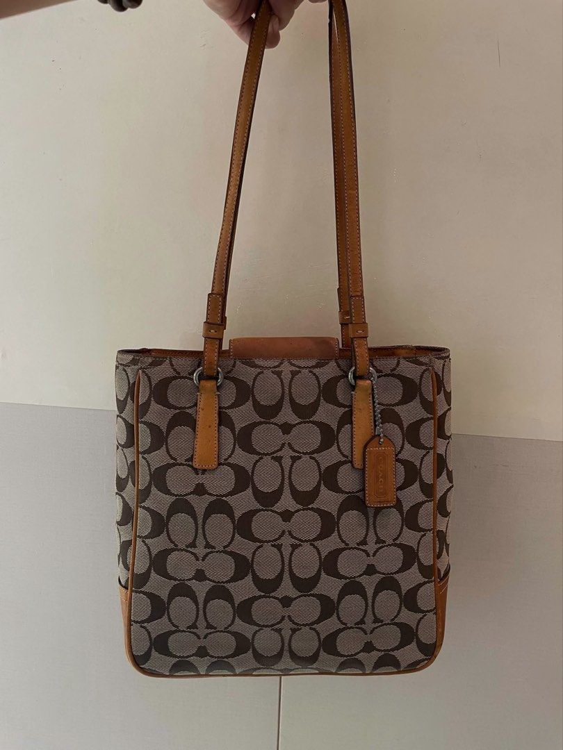 Coach Signature Monogram Tote (Category: Luxury Bags & Wallets) located in Manila. Submitted by thevintagebow (Listing ID 1460176277, Image 1). Description: Add a touch of timeless luxury to your daily OOTD with this classic Coach Signature Monogram Tote! 👜 Featuring the iconic brown canvas and rich leather trim, it’s a true vintage gem. ✨ Grab it for only ₱1,500 php (selling as-is) Run, don’t walk, because deals like this disappear fast! 🧡.