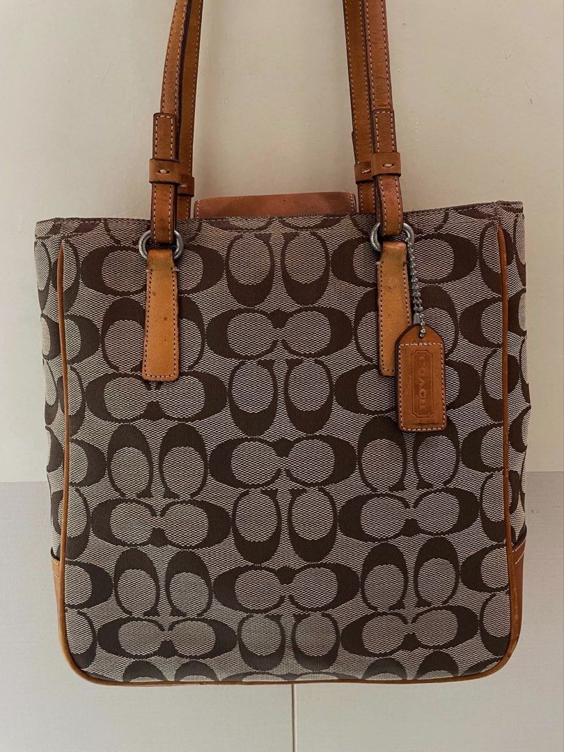 Coach Signature Monogram Tote (Category: Luxury Bags & Wallets) located in Manila. Submitted by thevintagebow (Listing ID 1460176277, Image 3). Description: Add a touch of timeless luxury to your daily OOTD with this classic Coach Signature Monogram Tote! 👜 Featuring the iconic brown canvas and rich leather trim, it’s a true vintage gem. ✨ Grab it for only ₱1,500 php (selling as-is) Run, don’t walk, because deals like this disappear fast! 🧡.