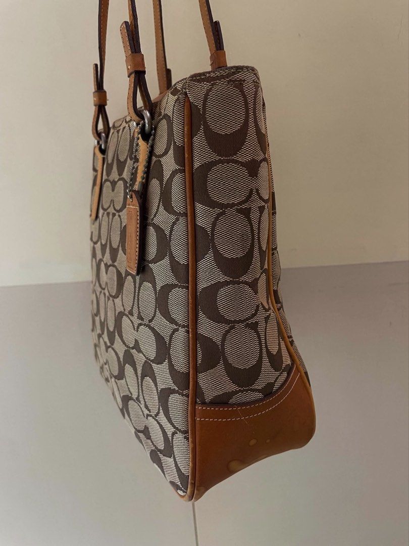 Coach Signature Monogram Tote (Category: Luxury Bags & Wallets) located in Manila. Submitted by thevintagebow (Listing ID 1460176277, Image 2). Description: Add a touch of timeless luxury to your daily OOTD with this classic Coach Signature Monogram Tote! 👜 Featuring the iconic brown canvas and rich leather trim, it’s a true vintage gem. ✨ Grab it for only ₱1,500 php (selling as-is) Run, don’t walk, because deals like this disappear fast! 🧡.