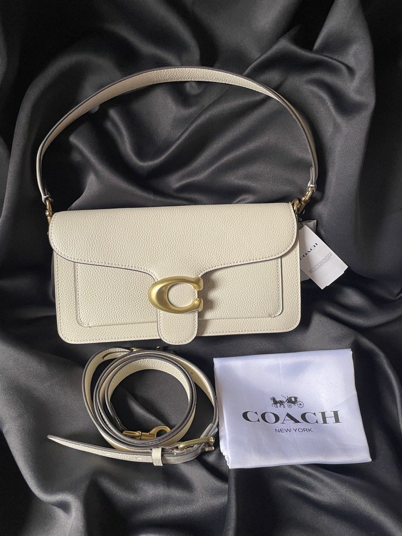 Coach Tabby Shoulder Bag 26 White Pebble Leather (Category: Luxury Bags & Wallets) located in Quezon City. Submitted by koreanitems_ (Listing ID 1460177785, Image 1). Description: - Brand new white pebble leather Coach Tabby bag - Includes adjustable strap and dust bag - Tags still attached - Multiple units available, all new and sealed - Versatile for everyday use or special occasions.