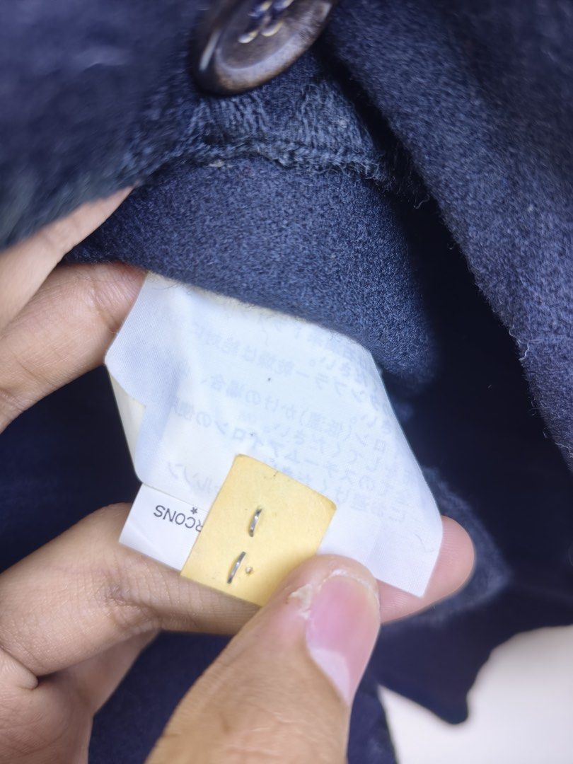 COMME des GARÇONS Tricot Cardigan (Category: Coats, Jackets and Outerwear) located in Manila. Submitted by declutterpromax (Listing ID 1460199109, Image 3). Description: - Brand: COMME des GARÇONS Tricot - Color: Black - Style: Cardigan - Features: Unique scalloped trim along neckline and button placket - Closure: Classic button closure - Versatility: Ideal for layering and adding a designer touch to outfits.