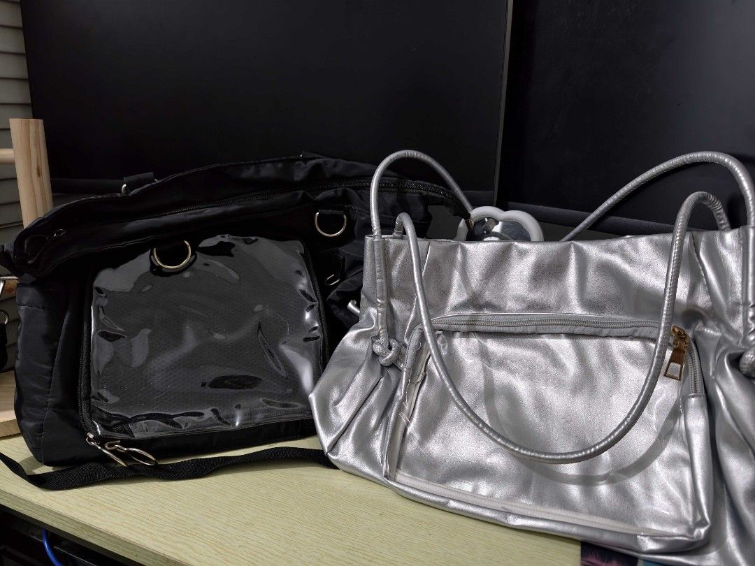 CONCERT BAG SET (Category: Tote Bags) located in Cavite. Submitted by drdct91 (Listing ID 1460178441, Image 1). Description: - Set of 2 stylish bags - Black tote bag with clear front window pocket and shoulder strap - Shiny silver shoulder bag with zippered pocket and smaller front pocket - Practical for everyday use or special events.