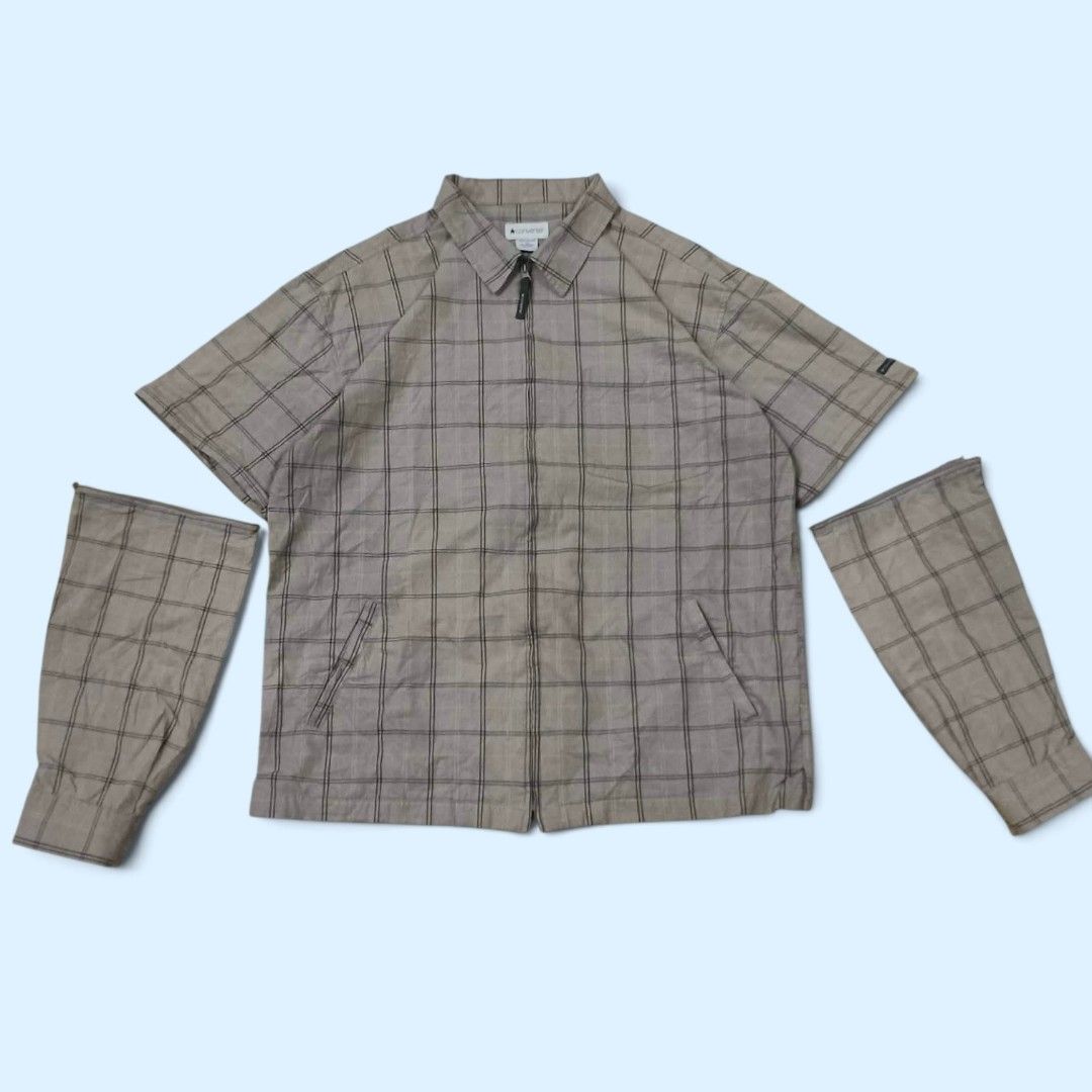 Converse Zip-Up Plaid Jacket with Detachable Sleeves (Category: Coats, Jackets and Outerwear) located in Indang. Submitted by shanlennon09 (Listing ID 1460173035, Image 1). Description: -L-XL - Stylish Converse jacket with a classic plaid pattern. - Features a convenient zip-up front closure. - Includes two functional pockets for your essentials. - Detachable sleeves offer versatility: wear as long-sleeve or short-sleeve. - Perfect for layering o