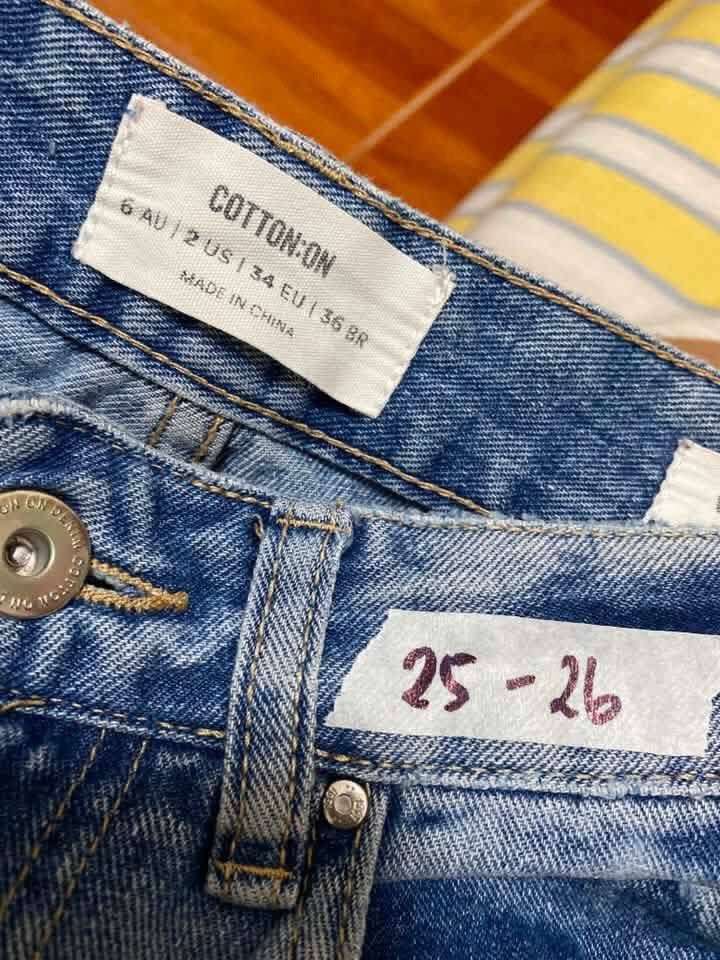 Cotton On Wide Leg Jeans Distressed Light Wash (Category: Jeans) located in Manila. Submitted by airamef28.closet (Listing ID 1460271621, Image 2). Description: - Light wash wide leg jeans from Cotton On - Features a frayed hem - Distressed details on front and back - Tag size: 6 AU / 2 US - Best fits waist sizes 25-26 inches - Ideal for a casual everyday look.