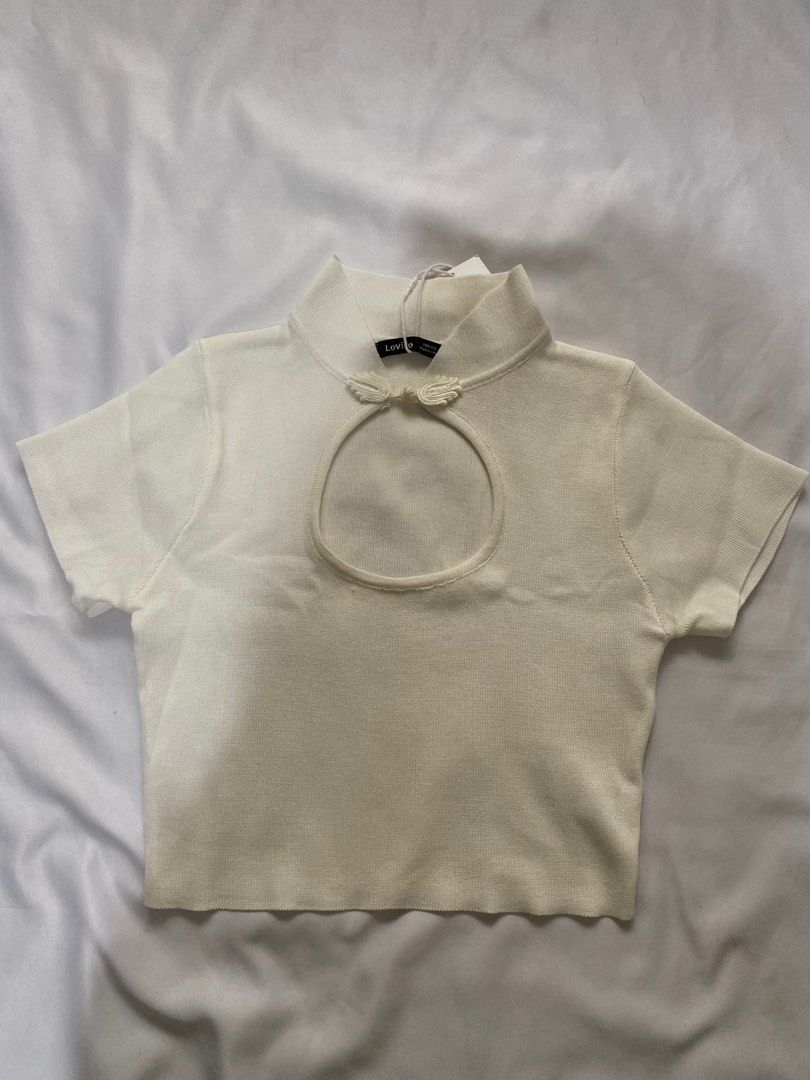 Cream Knit Mandarin Collar Top (Category: Blouses) located in Las Pinas. Submitted by shairaadriannx (Listing ID 1460136871, Image 1). Description: - Cream knit top from Lovito - Features a mandarin collar with a cute knot button detail - Short sleeves - Ribbed texture throughout - Versatile for layering or wearing solo.