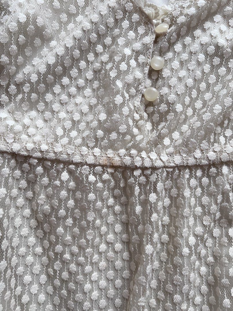 cream white babydoll top (Category: Sleeveless) located in Dasmarinas. Submitted by pinex (Listing ID 1460160194, Image 2). Description: - cream white lacy babydoll top - some discolorations due to storage - tag and extra button still intact - measurements laid flat: straps to hem: 25 in pit to pit: 16 in.