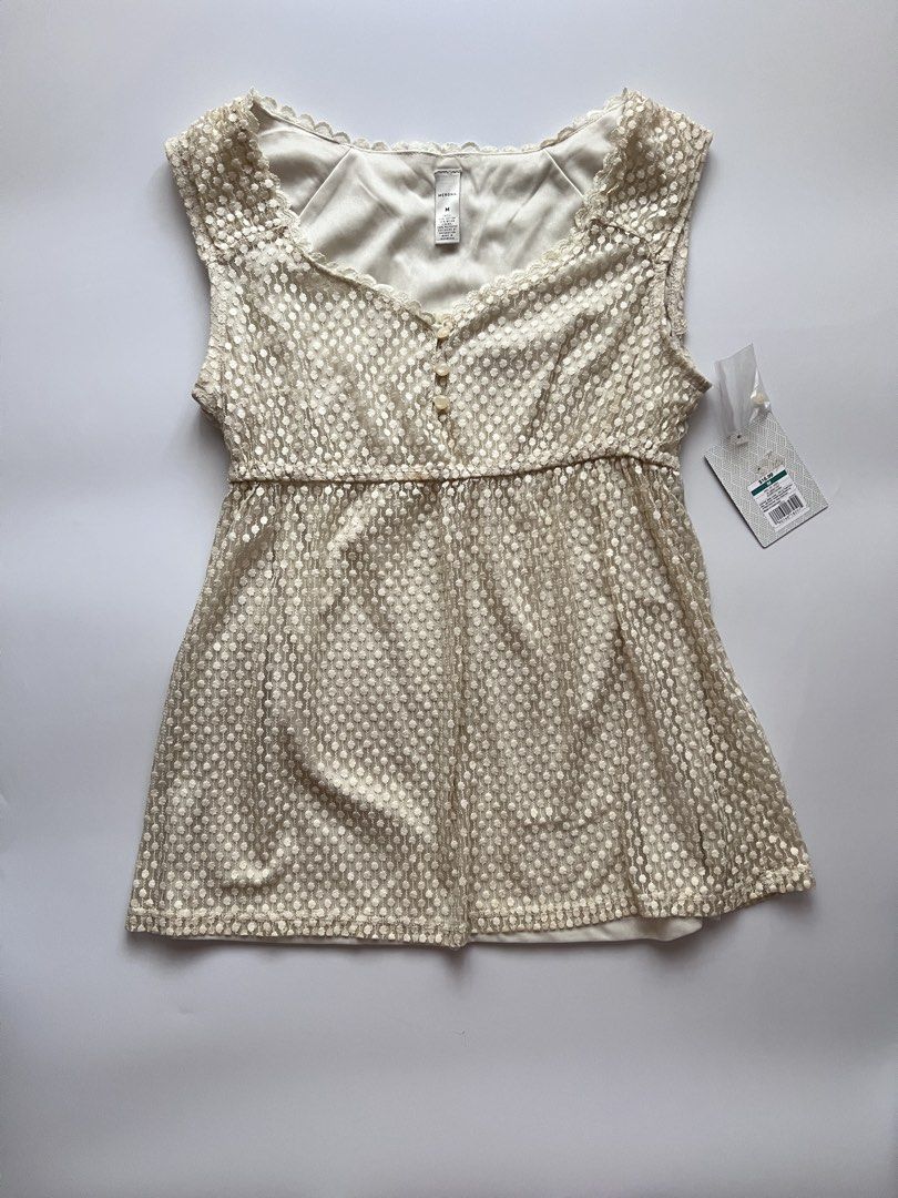 cream white babydoll top (Category: Sleeveless) located in Dasmarinas. Submitted by pinex (Listing ID 1460160194, Image 1). Description: - cream white lacy babydoll top - some discolorations due to storage - tag and extra button still intact - measurements laid flat: straps to hem: 25 in pit to pit: 16 in.