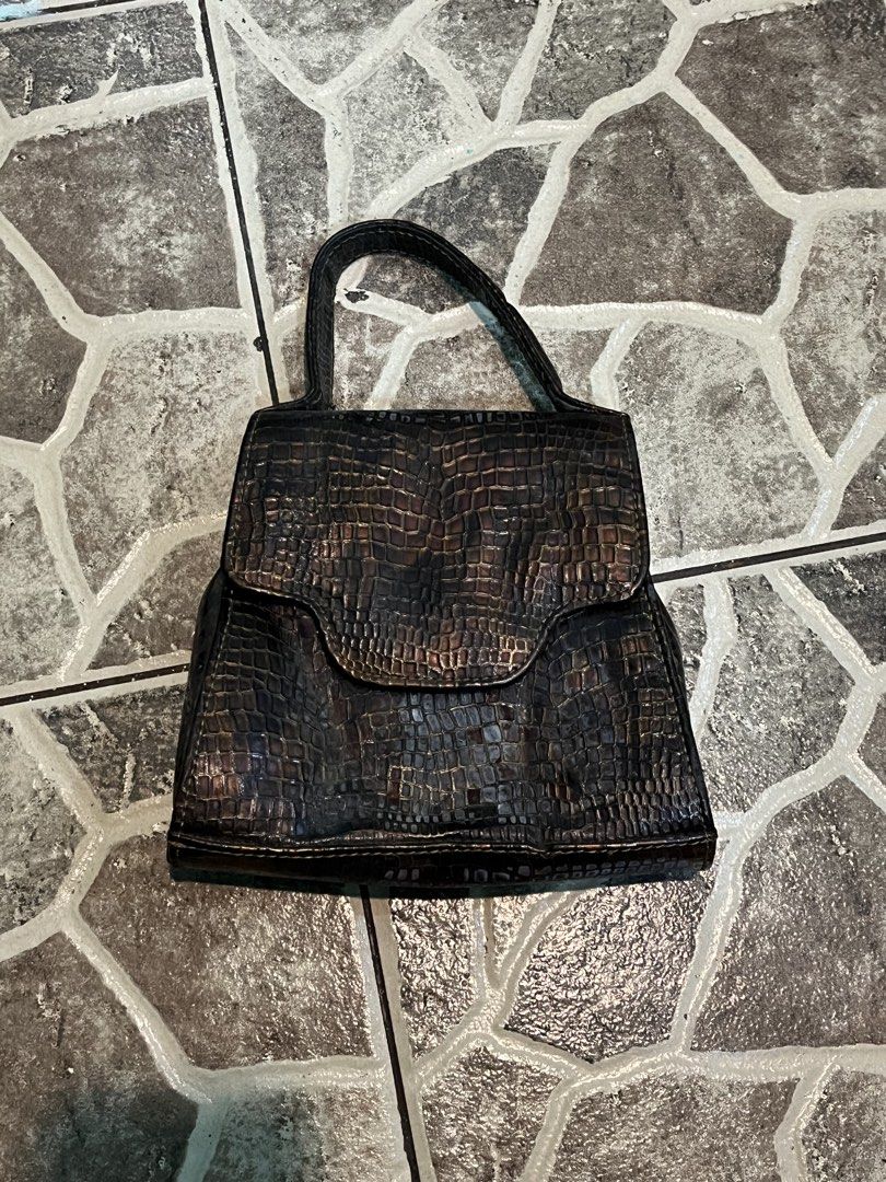 Crocodile skin hand bag (Category: Luxury Bags & Wallets) located in Manila. Submitted by mishichi (Listing ID 1460235258, Image 1). Description: vintage-style structured top-handle handbag featuring a distinctive crocodile skin texture. .