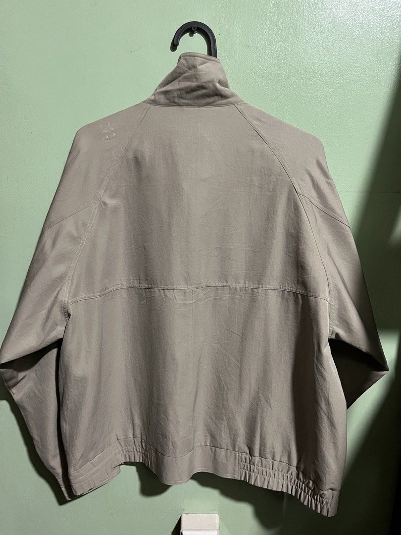 Current Stage - Men's Beige Bomber Jacket (Category: Coats, Jackets and Outerwear) located in Quezon City. Submitted by jethrohitosis (Listing ID 1460266176, Image 2). Description: - Price: 450 - Dimes: 24 x 24 - Classic beige bomber jacket - Zip-up front - Two button-flap pockets - Elasticated cuffs and hem - Simple and versatile outerwear - Great for layering.