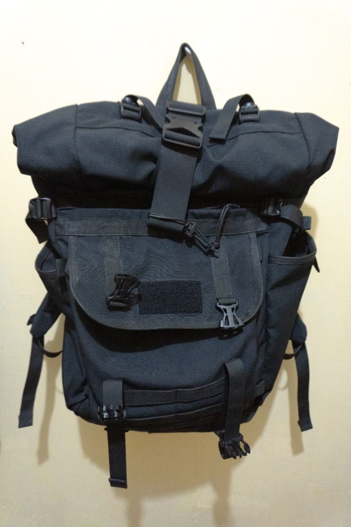 Custom Black Roll-Top Backpack (Up to 35L) (Category: Backpacks) located in Marikina City. Submitted by made4made (Listing ID 1460132106, Image 2). Description: Custom Black Roll-Top Backpack (Up to 35L) Selling my custom black roll-top backpack. High quality build from a local brand (Negotiable) Almost new, ilang beses ko lang nagamit for my laptop. Originally customized specifically to fit my ROG laptop. Works great as a sleek office bag or a h