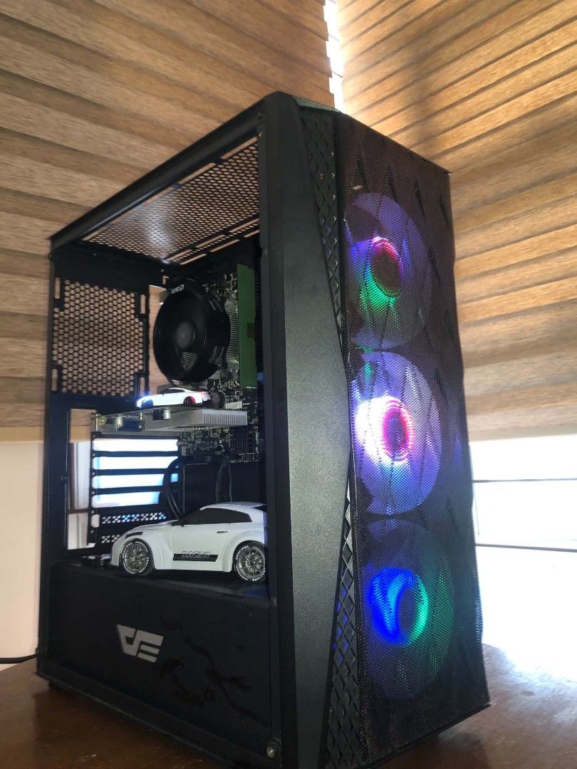 Custom Gaming PC - AMD Ryzen, NVIDIA GeForce GT 730 (Category: Desktops) located in Las Pinas. Submitted by richoco05 (Listing ID 1460218638, Image 1). Description: Murang Light Gaming Unit with GPU ₱7K ONLY AMD Athlon 200GE A320M-K Pro (no i/o shield) 8GB DDR4 3200Mhz NVIDIA GeForce GT 730 GDDR5 2GB Kingstom 120GB 99% Darkash DK352 ATX (no glass panel) Jungle Leopard 6-pin RGB Fan Hub YGT 750W Windows 10 Pro can play easily: Valorant, LoL, Dota 