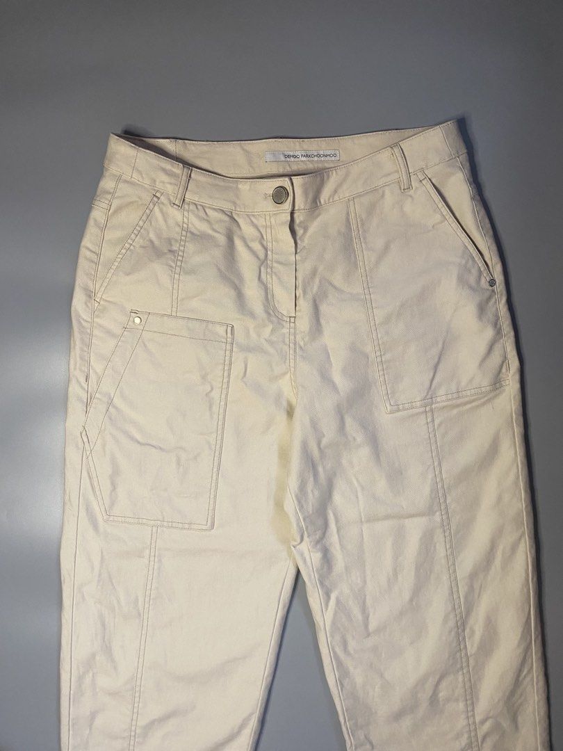 DEMOO PARKCHOONMOO Beige Cropped Pants (Category: Other Bottoms) located in Manila. Submitted by syke.archiveorg (Listing ID 1460141743, Image 2). Description: - Beige cropped pants - Brand: DEMOO PARKCHOONMOO - Relaxed fit - Multiple pockets - Unique stitching details - Ideal for casual wear - Refer to label for material and care instructions.