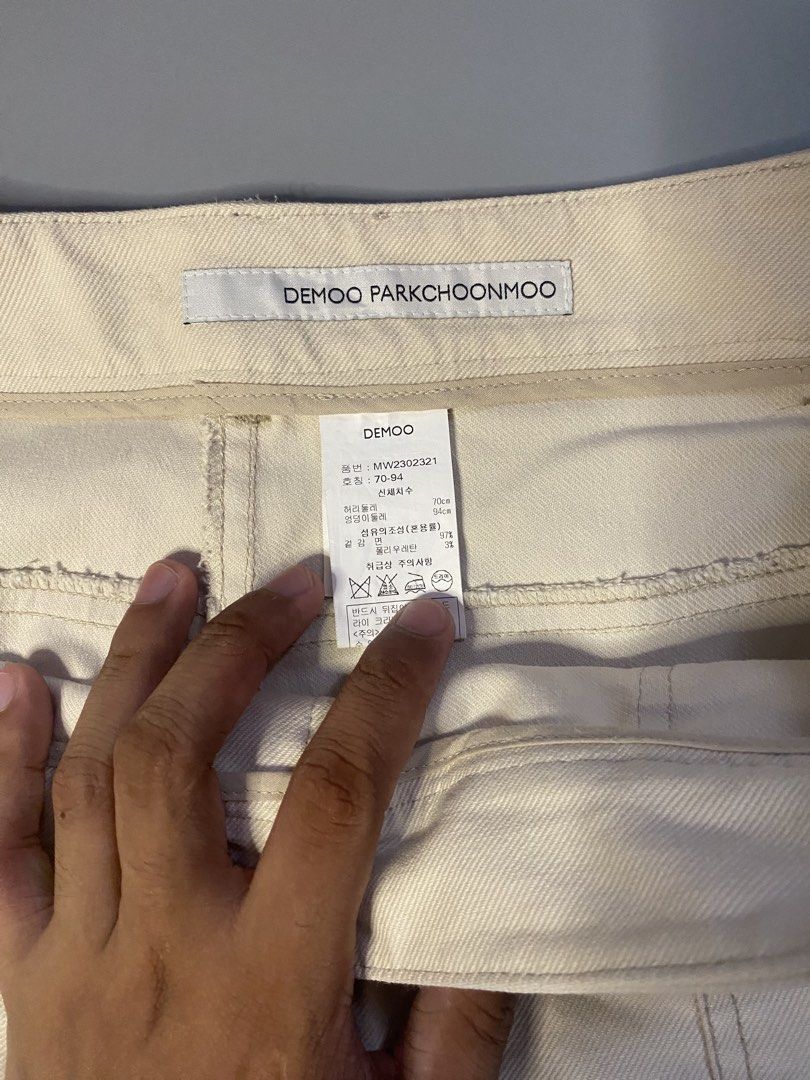 DEMOO PARKCHOONMOO Beige Cropped Pants (Category: Other Bottoms) located in Manila. Submitted by syke.archiveorg (Listing ID 1460141743, Image 3). Description: - Beige cropped pants - Brand: DEMOO PARKCHOONMOO - Relaxed fit - Multiple pockets - Unique stitching details - Ideal for casual wear - Refer to label for material and care instructions.