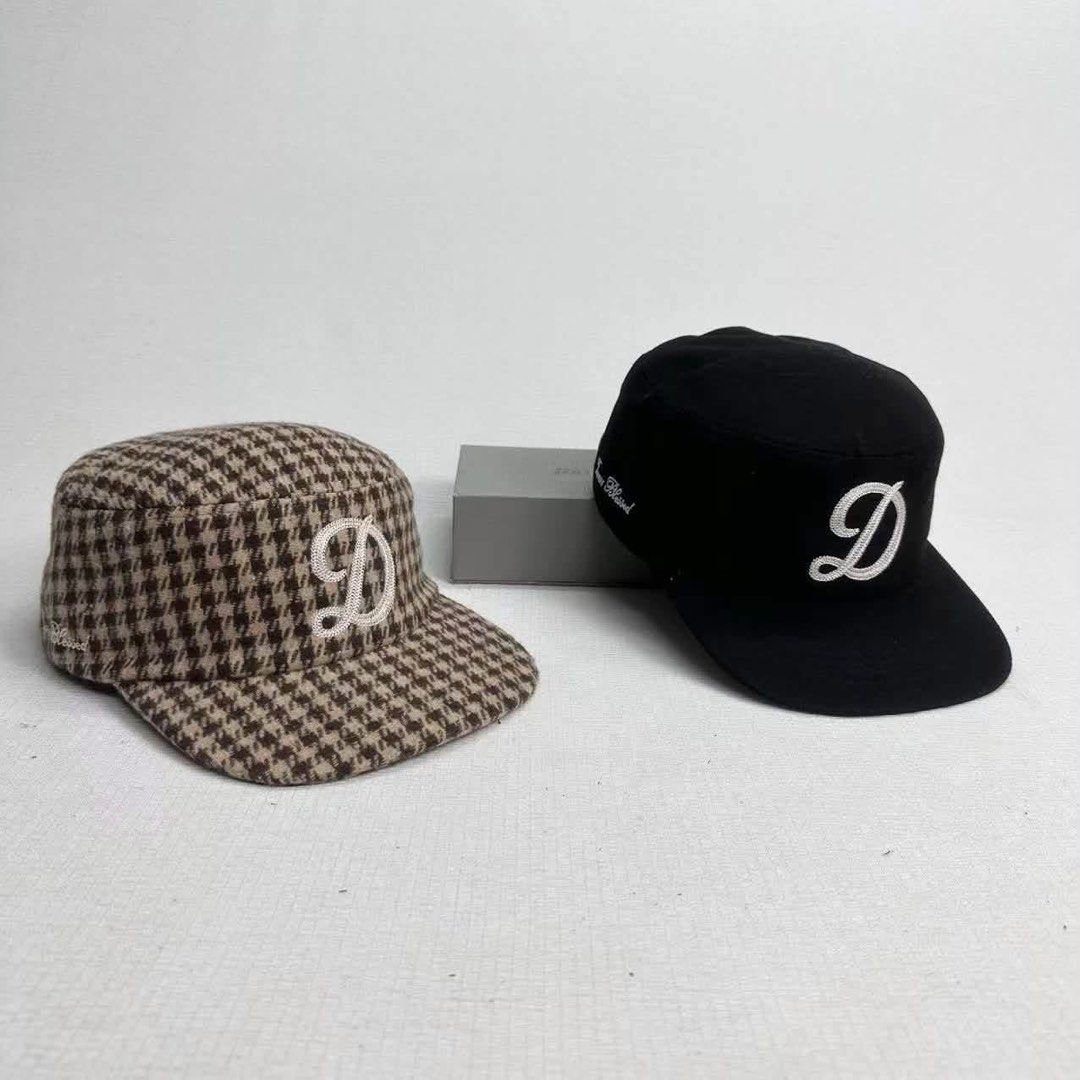 Designer 'D' Embroidered Caps - Plaid & Solid Styles (Category: Caps & Hats) located in Quezon City. Submitted by 2much_earl (Listing ID 1460219050, Image 2). Description: - Two pairs of caps available. - Style 1: Plaid pattern with a dark brim. - Style 2: Solid black cap. - Both caps feature a white embroidered 'D' logo. - Ideal for casual wear. - Feel free to ask any questions!.