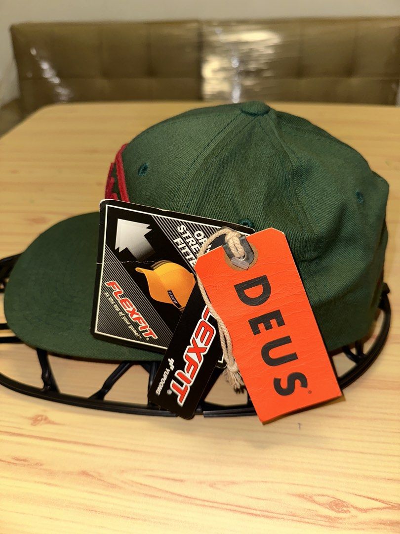 Deus Ex Machina Green Flexfit Cap (Category: Caps & Hats) located in Quezon City. Submitted by mancave_stuff (Listing ID 1460106111, Image 2). Description: - Deus Ex Machina Green cap - Features a red embroidered logo on the front - "Deus Ex Machina" text embroidered on the back - Equipped with Flexfit technology for a comfortable, snug fit - Brand new with tags attached.
