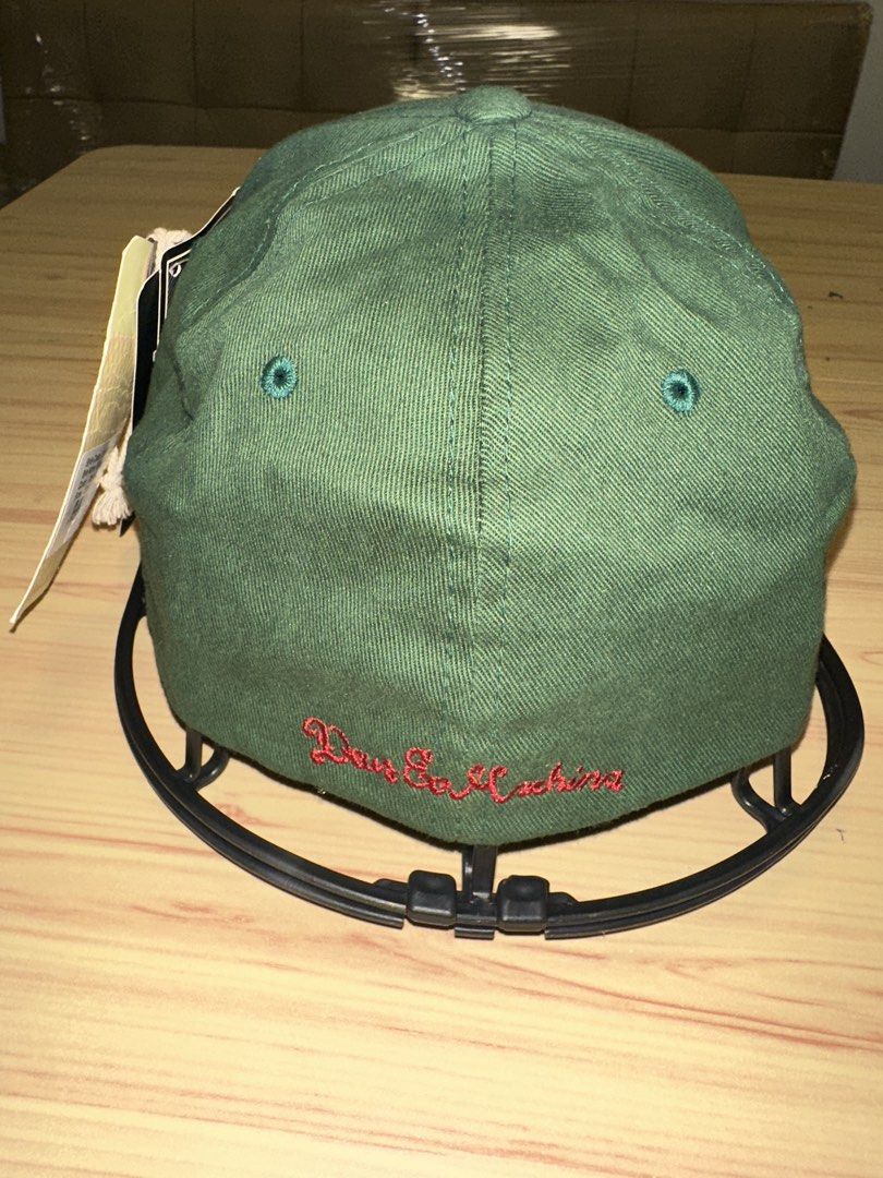 Deus Ex Machina Green Flexfit Cap (Category: Caps & Hats) located in Quezon City. Submitted by mancave_stuff (Listing ID 1460106111, Image 3). Description: - Deus Ex Machina Green cap - Features a red embroidered logo on the front - "Deus Ex Machina" text embroidered on the back - Equipped with Flexfit technology for a comfortable, snug fit - Brand new with tags attached.