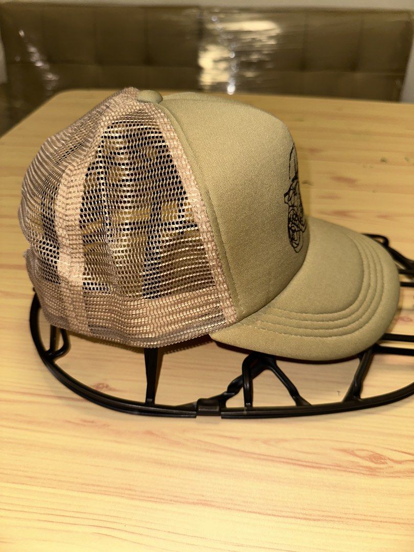 Deus ex Machina Khaki Trucker Cap (Category: Caps & Hats) located in Quezon City. Submitted by mancave_stuff (Listing ID 1460105717, Image 2). Description: - Deus ex Machina Khaki trucker cap with vintage cafe racer motorcycle - Breathable mesh back for comfort - Adjustable strap for a customized fit - Ideal for everyday casual wear - Made in China (60% Polyester, 40% Nylon).