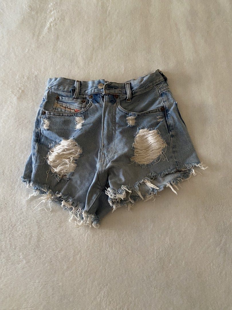 Diesel Distressed Denim Shorts Size 33 (Category: Shorts) located in Batangas. Submitted by v.ukay (Listing ID 1460132180, Image 1). Description: - Brand: Diesel - Style: Light wash denim shorts - Features: Distressed rips, frayed hem - Pockets: Classic five-pocket style - Closure: Zip fly - Size: 33 - Occasion: Casual wear.
