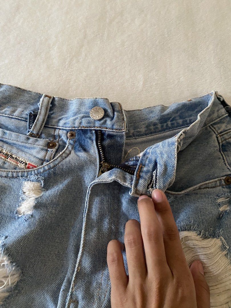 Diesel Distressed Denim Shorts Size 33 (Category: Shorts) located in Batangas. Submitted by v.ukay (Listing ID 1460132180, Image 2). Description: - Brand: Diesel - Style: Light wash denim shorts - Features: Distressed rips, frayed hem - Pockets: Classic five-pocket style - Closure: Zip fly - Size: 33 - Occasion: Casual wear.