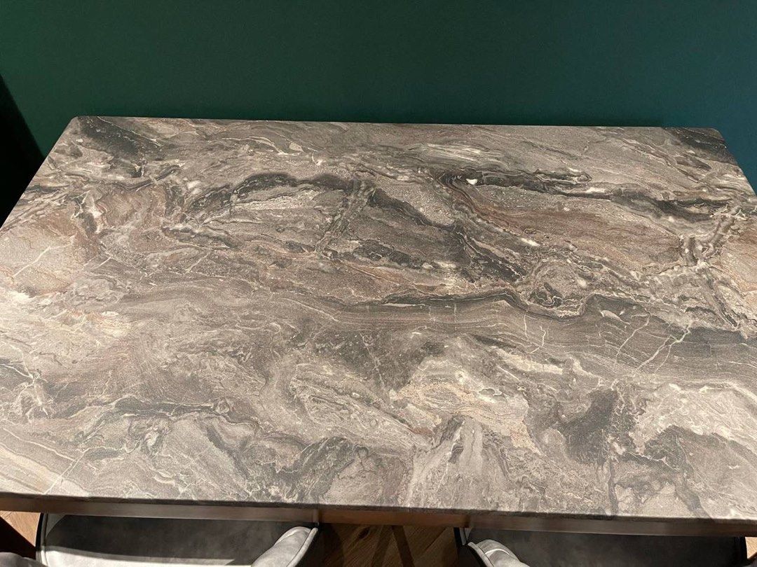 Dining table (Category: Tables & Sets) located in Singapore. Submitted by kam.sani (Listing ID 1460133257, Image 2). Description: Stylish dining set featuring a marble-look table without chairs. Table dimensions are approximately 134cm × 80cm. Perfect for small spaces or as a stylish accent piece..