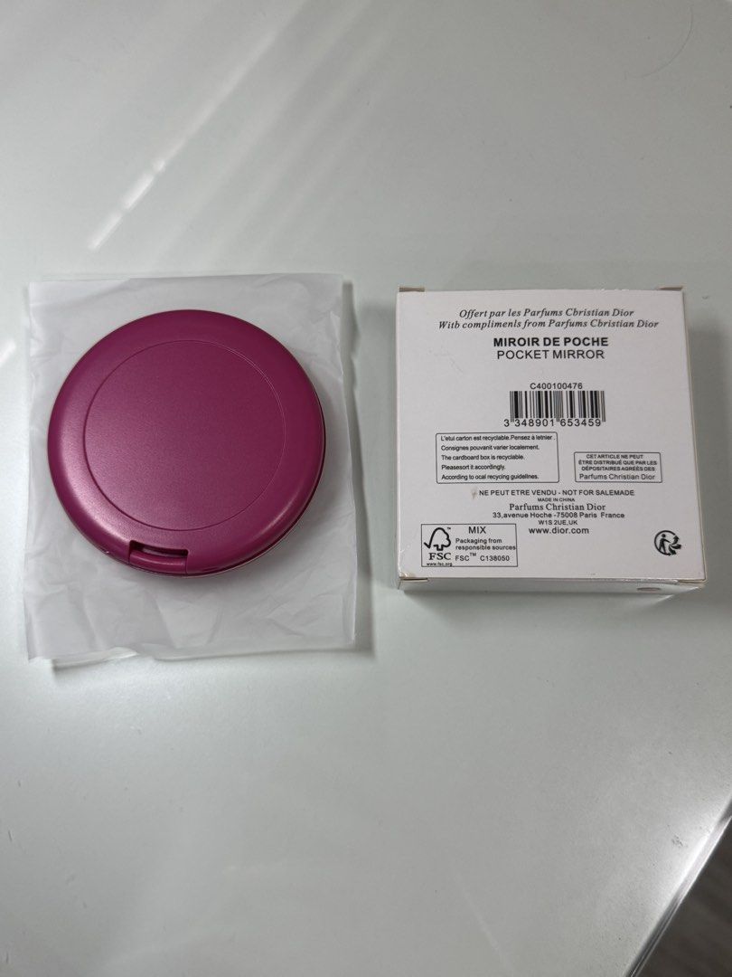 Dior Hot Pink Quilted Logo Pocket Mirror (Category: Mirrors) located in Manila. Submitted by decluterrrr (Listing ID 1460127251, Image 3). Description: - Authentic Christian Dior pocket mirror - Features a bright pink quilted design with iconic CD logo - Opens to reveal two mirrors - Promotional item from Dior perfumes - Comes with original box and packaging.