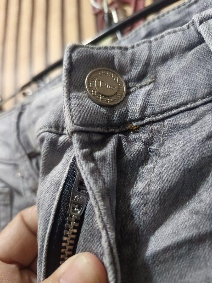 Dior Jeans Acid Wash (Category: Luxury Apparel) located in Cebu City. Submitted by iamnegotiable (Listing ID 1460222534, Image 2). Description: Dior Jeans Dior Men's gray wash jeans Slim fit jeans ykk complete tags Dimes measured on flat surface Waistline 32-33 Length 40 Leg opening 6-6.5 inch issue may white spot bleach available price negotiable.