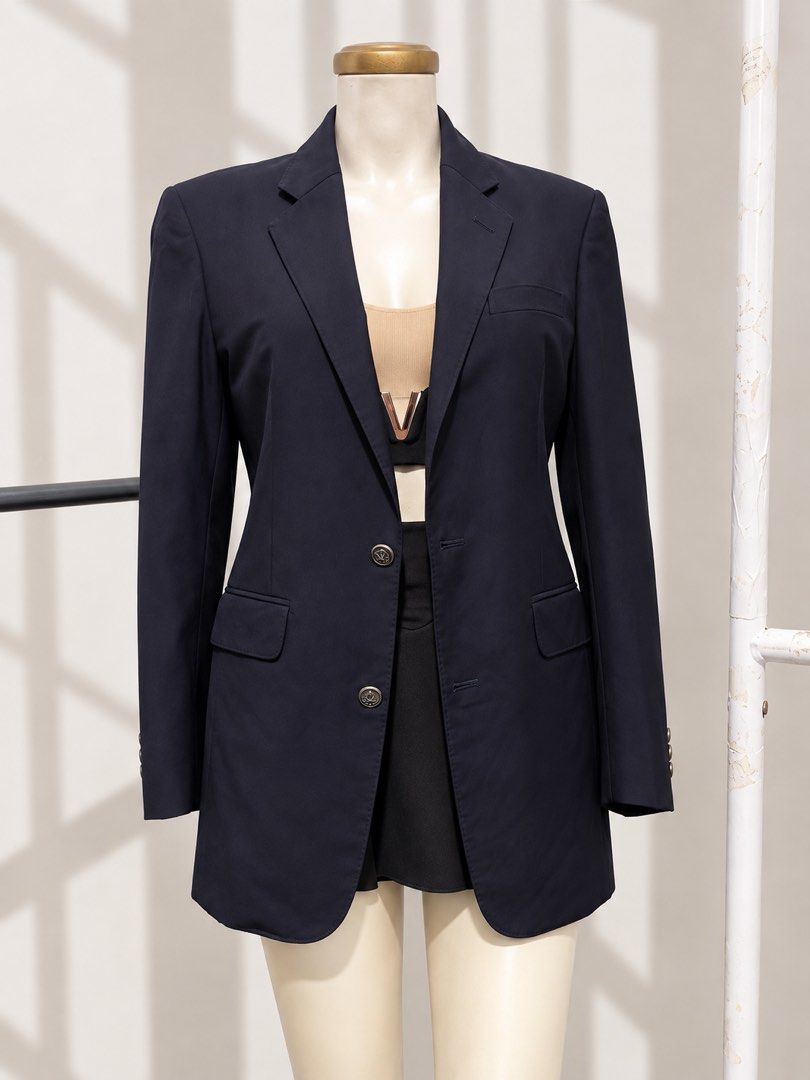 DIOR NAVY BLUE (Category: Coats, Jackets and Outerwear) located in Taguig. Submitted by vm.co (Listing ID 1460266139, Image 1). Description: Perfect for: * Corporate office wear * Business travel * Smart casual outfits * Rainy or cool weather * Capsule wardrobe * Everyday sophisticated styling Condition: Appears to be in very good preloved condition with no visible major stains, tears, or discoloration in the photo. A light steam will give it a c