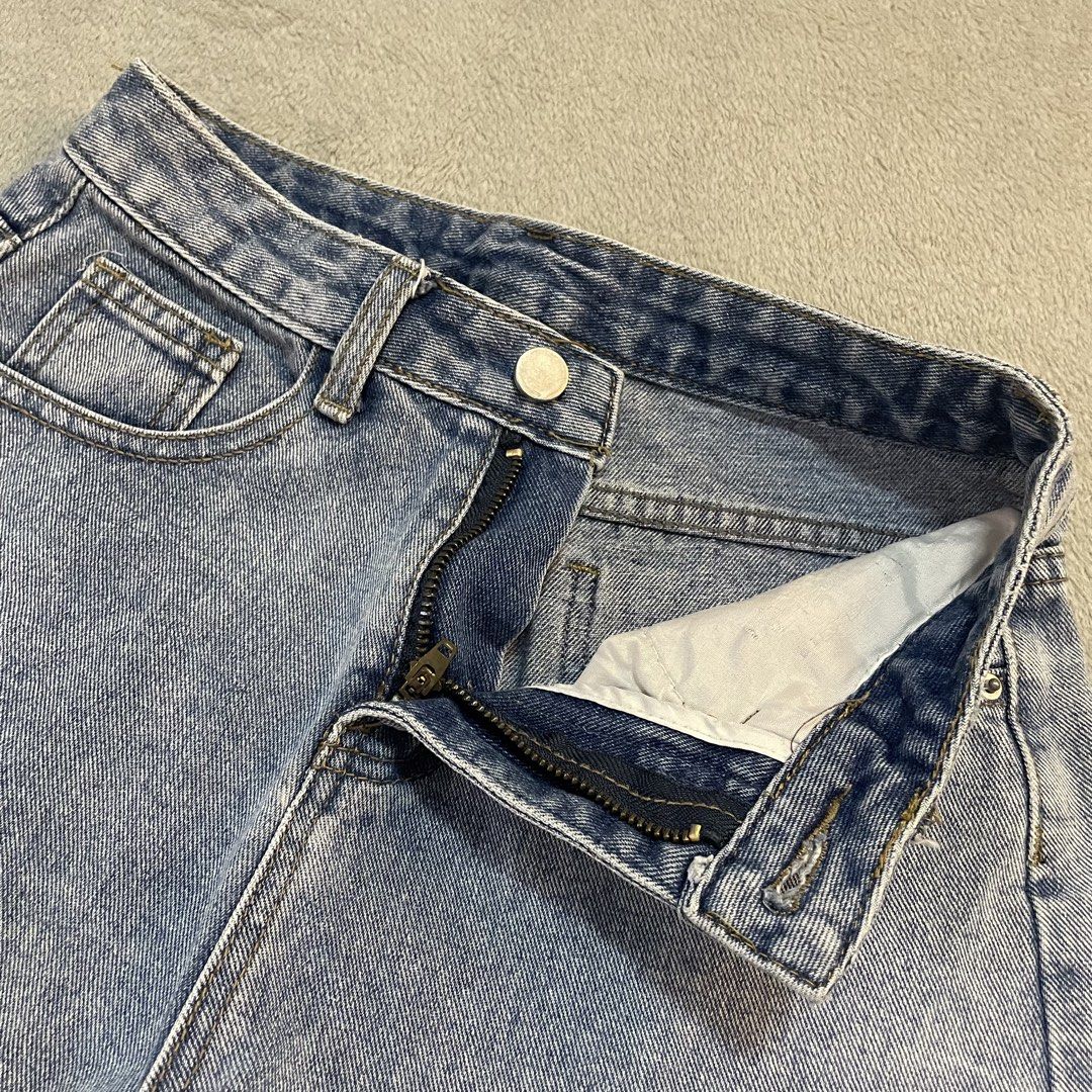 Distressed Denim Shorts with Frayed Hem (Category: Shorts) located in Taguig. Submitted by shopgrocer (Listing ID 1460159351, Image 3). Description: Distressed blue denim shorts with frayed hem and rips. High-waisted with button/zip closure and pockets. Perfect for casual outfits..