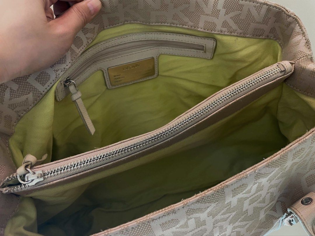 DKNY Monogram Canvas Shoulder Bag (Category: Luxury Bags & Wallets) located in Manila. Submitted by thevintagebow (Listing ID 1460184588, Image 3). Description: Elevate your everyday style with a heavy dose of Y2K nostalgia! 🍋‍🟩 This authentic DKNY monogram canvas shoulder bag features striking silver hardware, functional double buckles, and a gorgeous pop of lime-green lining inside. 🍃 Grab this iconic piece for just ₱3,000 PHP (valued at ₱5,
